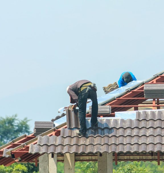 worker-installing-roof-tiles-min